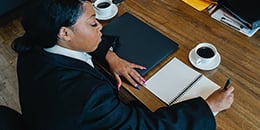 260px-woman-desk-looking-down-coffee